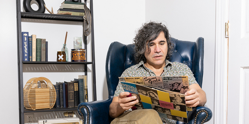 Man sitting in a chair reading