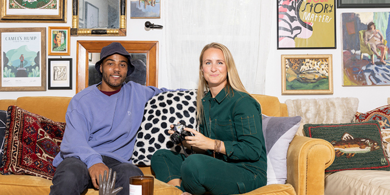A man and a woman smiling at the camera